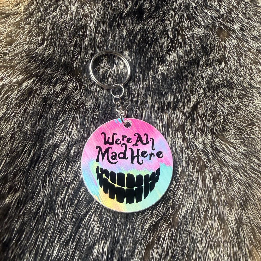 Colorful 'We're All Mad Here' Keychain